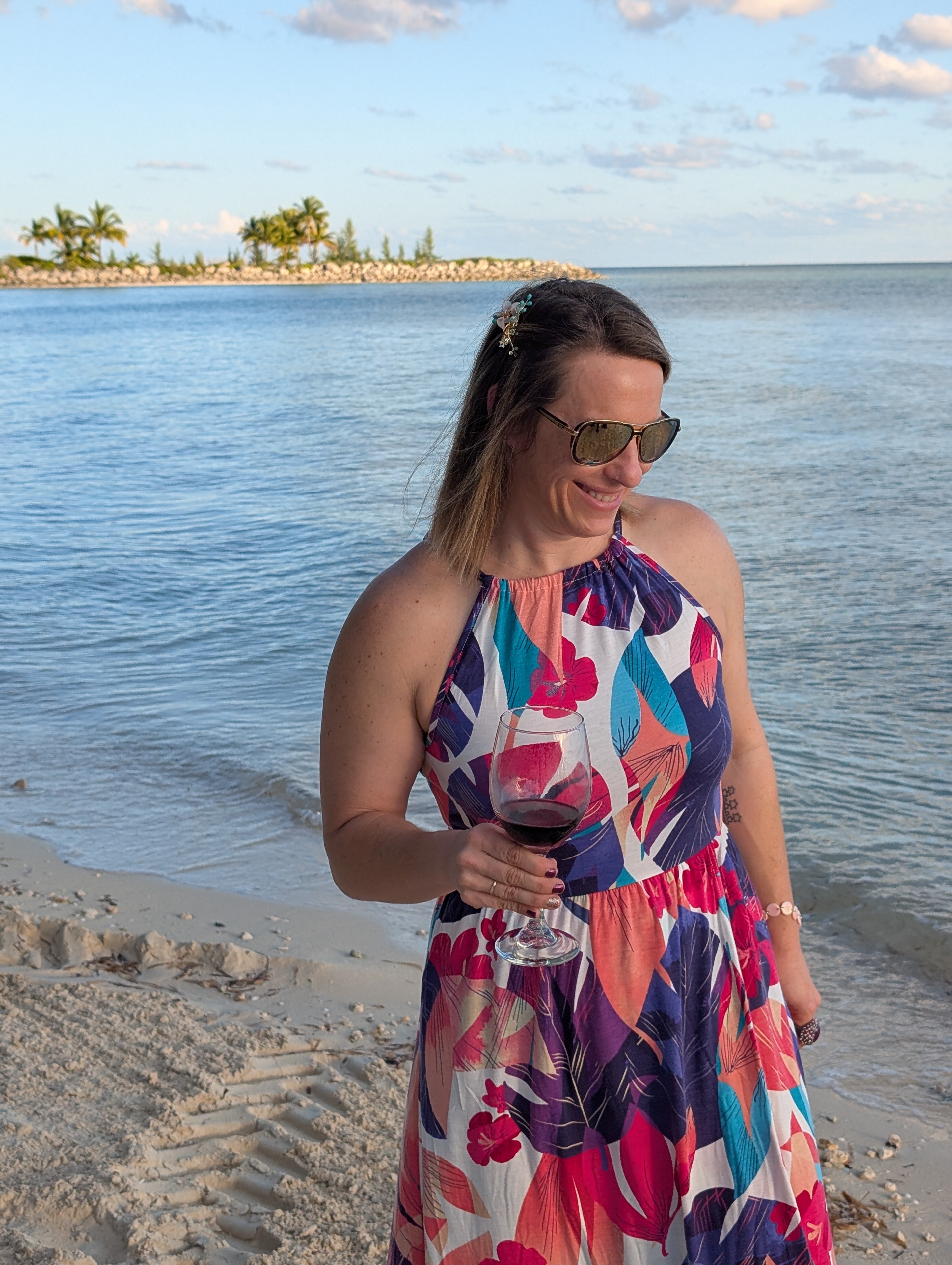Elizabeth Buffy on the beach in a floral dress
